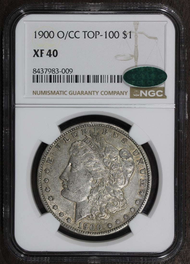 NGC CAC 1900-O CC Morgan Silver Dollar XF40: NGC CAC 1900-O CC Morgan Silver Dollar XF40 This is a 1900-O/CC Morgan Silver Dollar, featuring the O over CC variety. Graded XF40 by NGC and approved by CAC, this circulated coin is composed of 0.9 f
