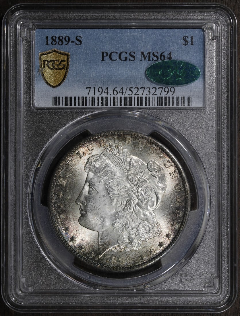 1889 San Francisco Morgan Silver Dollar PCGS MS64 CAC Toned: 1889 San Francisco Morgan Silver Dollar PCGS MS64 CAC Toned This 1889 Morgan Silver Dollar was minted in San Francisco and is composed of 0.9 fine silver. Graded MS64 by PCGS and featuring CAC approva