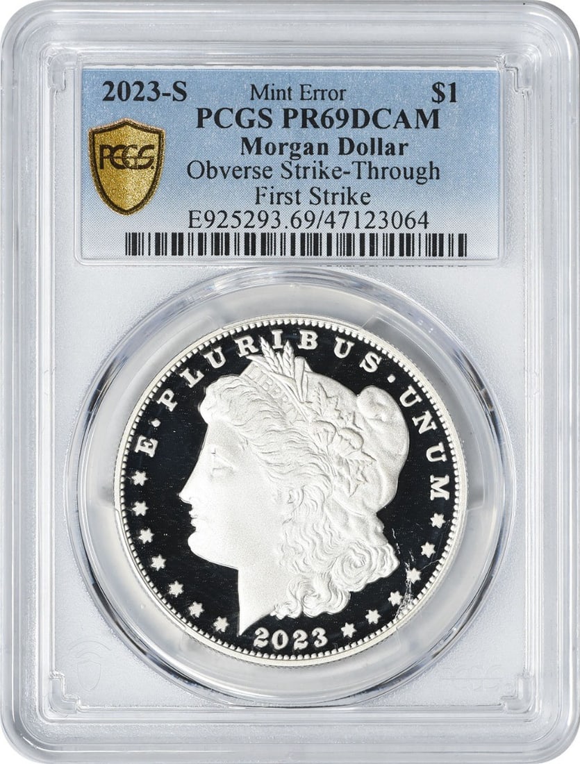 2023-S Morgan Dollar PCGS PR69DCAM Strike-Through Proof: 2023-S Morgan Dollar PCGS PR69DCAM Strike-Through Proof This 2023-S Morgan Silver Dollar features an obverse strike-through and is graded PR69DCAM by PCGS. The coin is uncirculated and struck in proof