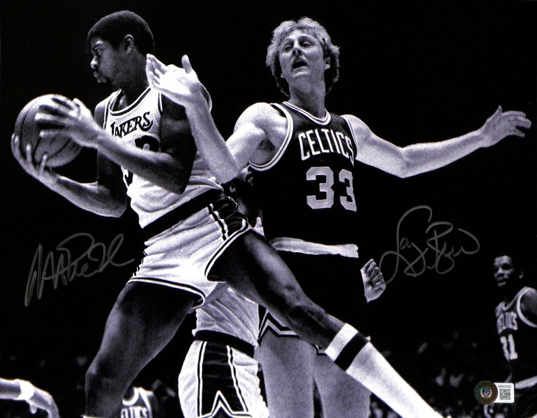 Dual signed Larry Bird Magic Johnson 11x14 Beckett photo: Dual signed Larry Bird Magic Johnson 11x14 Beckett photo This 11x14 black-and-white photograph captures basketball legends Larry Bird and Magic Johnson in action during a classic Boston Celtics vs. Lo