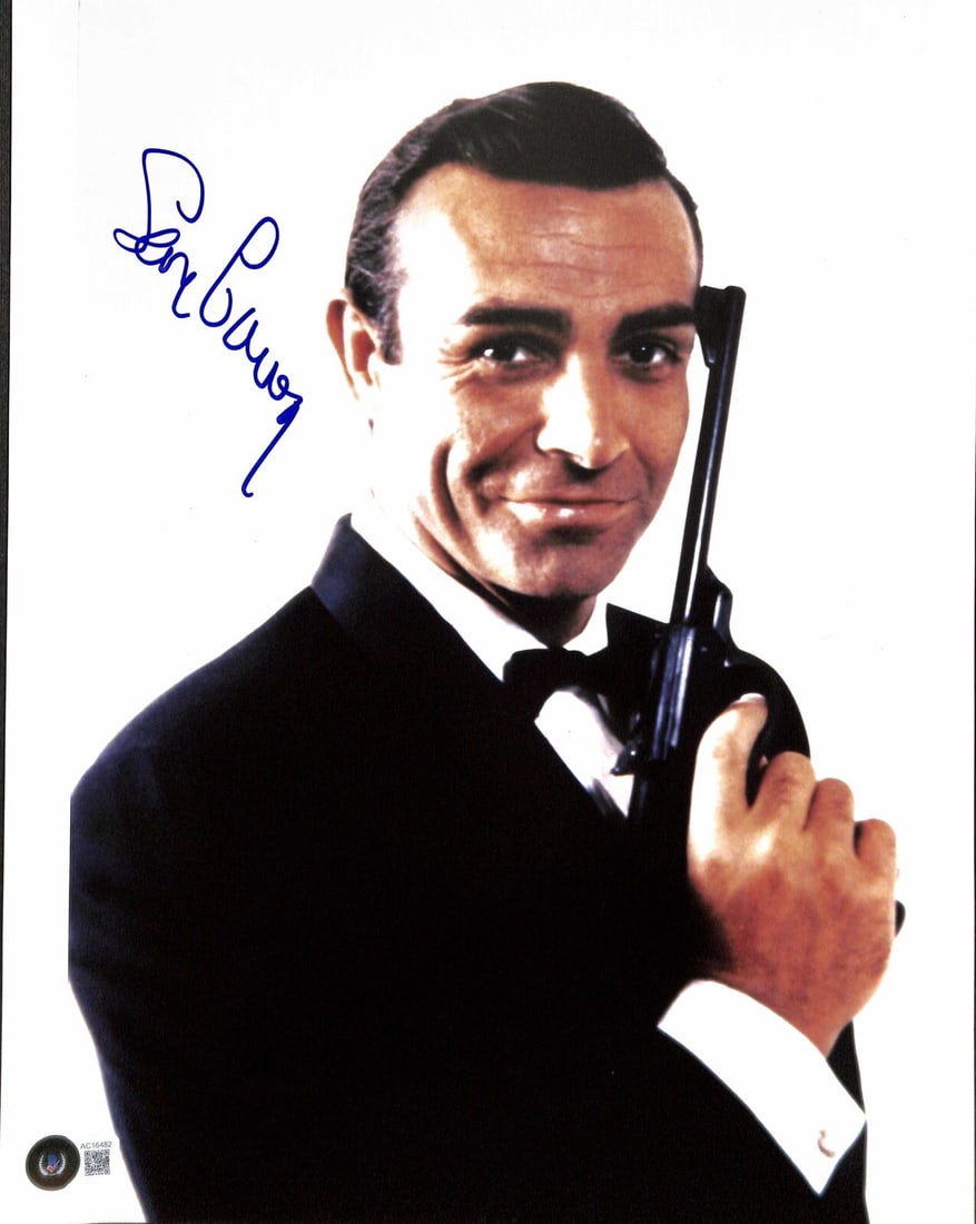 Sean Connery Autographed James Bond 11x14 Photo with Beckett LOA: Sean Connery Autographed James Bond 11x14 Photo with Beckett LOA This is an original 11x14 photograph signed by actor Sean Connery, known for his role in the James Bond movies. The autograph, in blue 