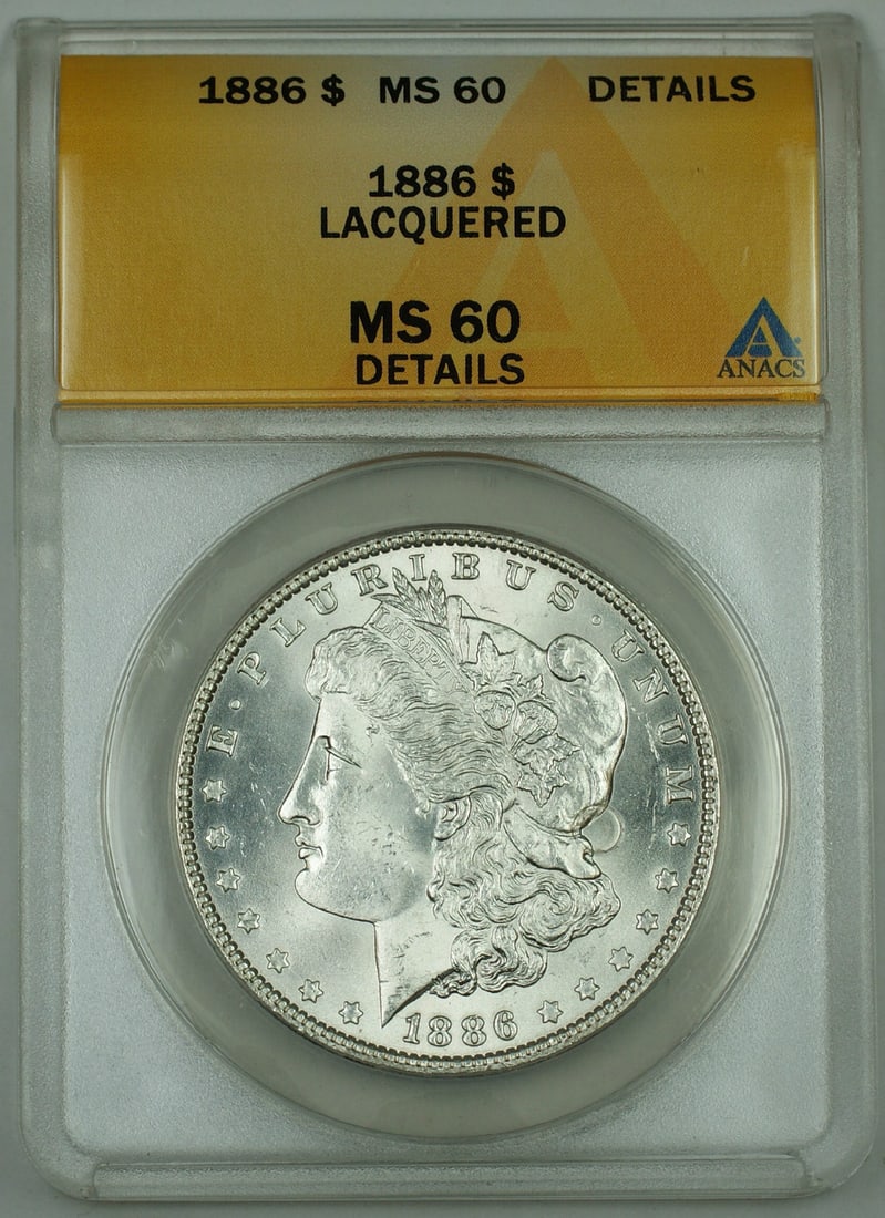 ANACS MS 60 Details 1886 Morgan Silver Dollar Lacquered: ANACS MS 60 Details 1886 Morgan Silver Dollar Lacquered This 1886 Morgan Silver Dollar coin is graded ANACS MS-60 Details and has been noted as lacquered. The coin is uncirculated and composed of silv