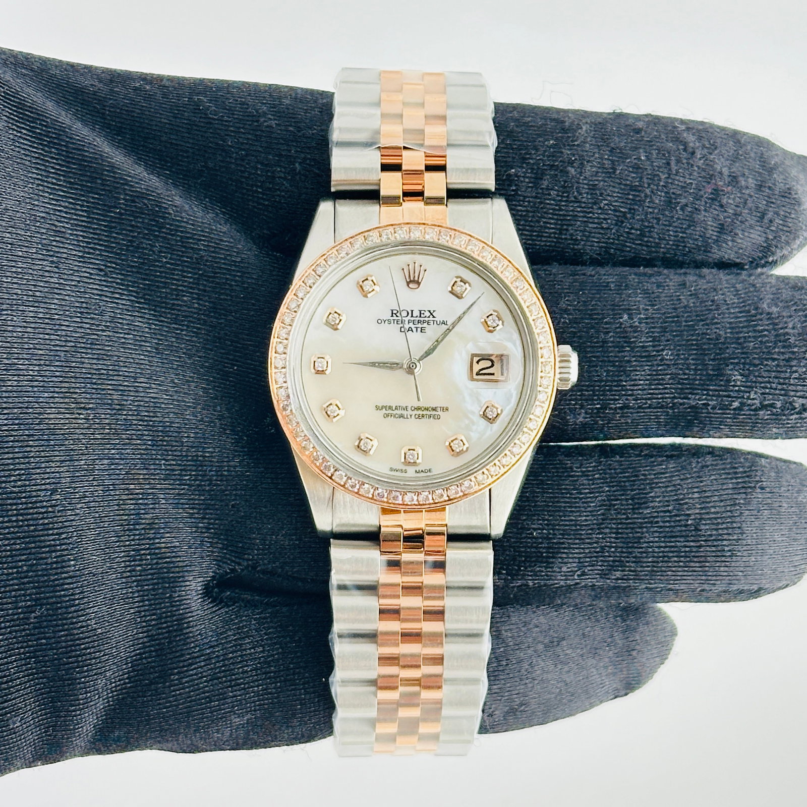Rolex Date Ref. 6694 Aftermarket White MOP Dial Jubilee Bracelet: Rolex Date Ref. 6694 Aftermarket White MOP Dial Jubilee Bracelet Rolex Date Ref. 6694 unisex watch with an Aftermarket White MOP dial featuring rose diamond markers, a pave RG plated diamond bezel, an