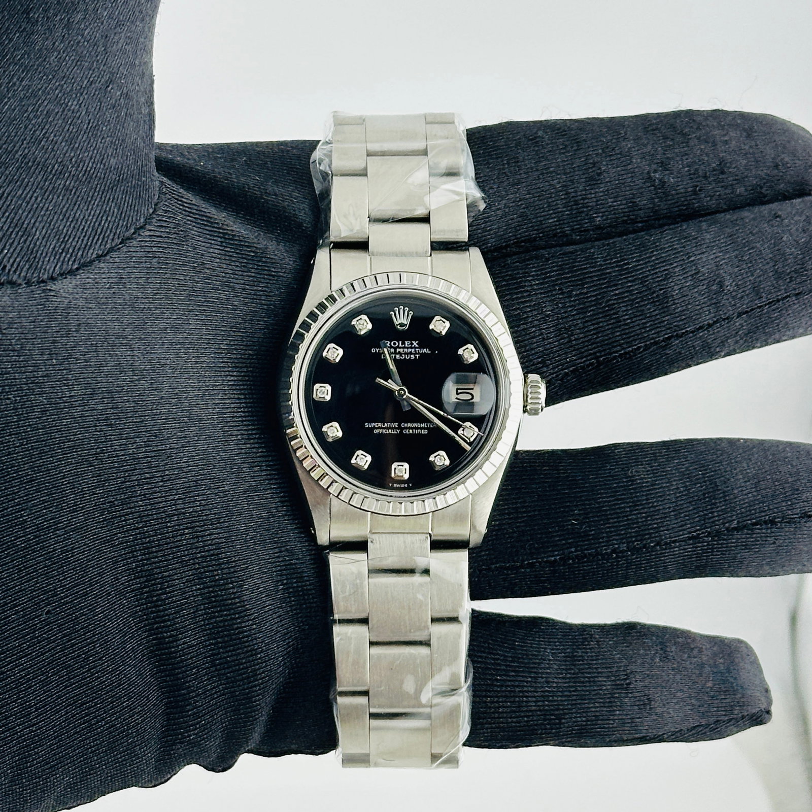 Rolex Aftermarket Black Diamond Dial Oyster Bracelet Datejust Ref 1603 Mens Watch: Rolex Aftermarket Black Diamond Dial Oyster Bracelet Datejust Ref 1603 Mens Watch This is a men's Rolex Datejust watch, reference 1603, featuring an aftermarket black diamond dial and an aftermarket O
