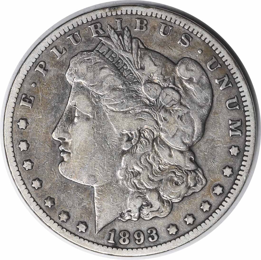 1893-CC Morgan Silver Dollar Uncertified VF 90% Silver Coin: 1893-CC Morgan Silver Dollar Uncertified VF 90% Silver Coin This 1893-CC Morgan Silver Dollar is a circulated coin that showcases the craftsmanship of designer George T. Morgan. With a composition of 