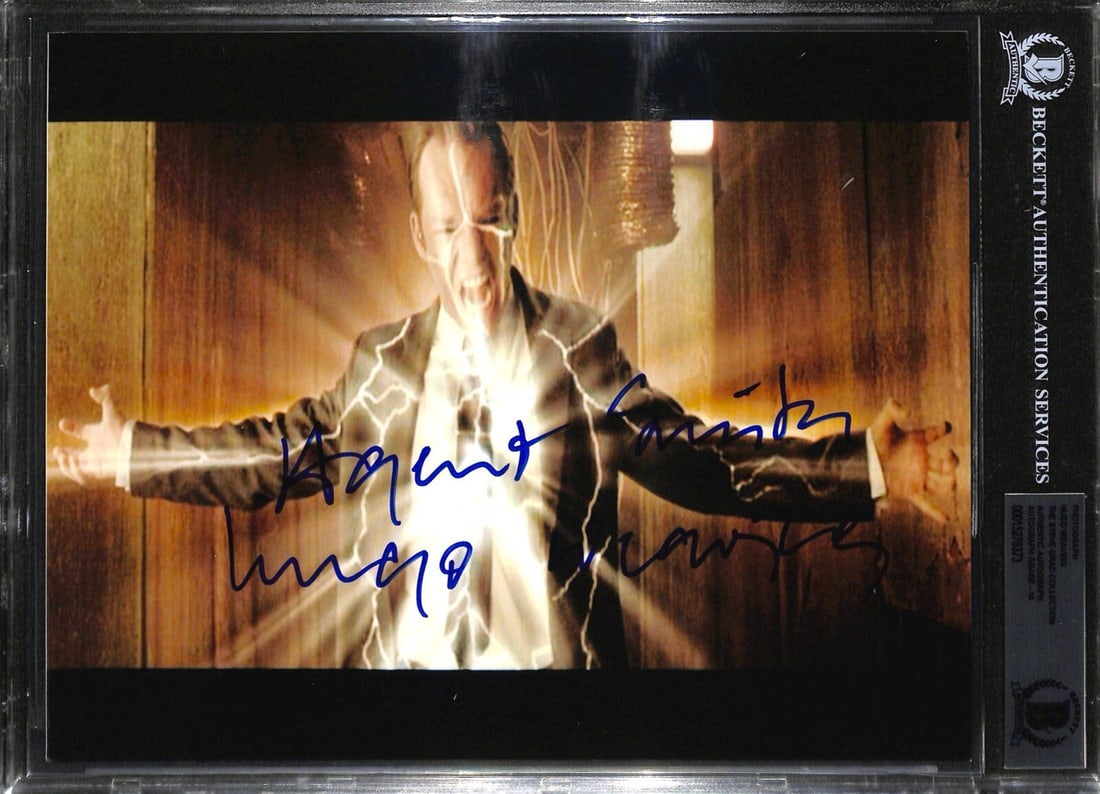 Hugo Weaving Signed 8x10 Photo Inscribed Agent Smith Beckett Authenticated: Hugo Weaving Signed 8x10 Photo Inscribed Agent Smith Beckett Authenticated This stunning 8x10 color photograph features a signed and inscribed image of actor Hugo Weaving as Agent Smith from The Matri