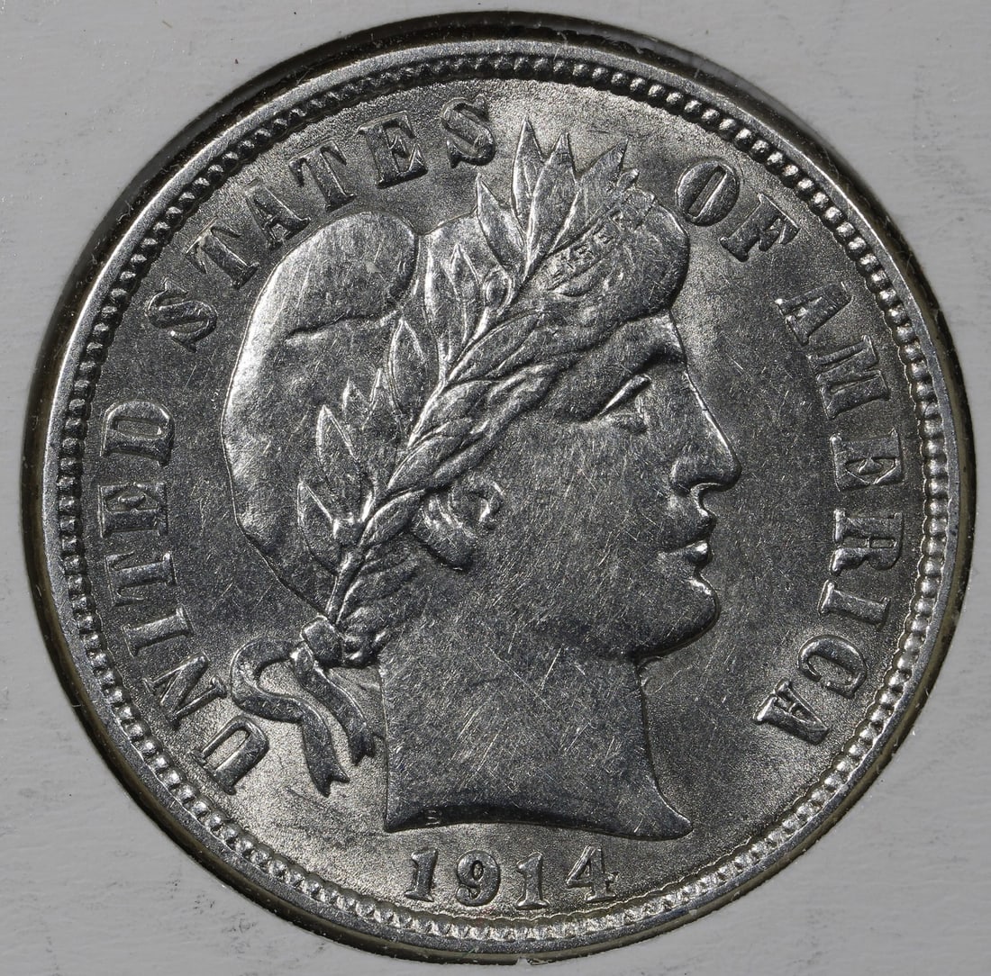1914 United States Barber 10C Silver Dime UNC: 1914 United States Barber 10C Silver Dime UNC A 1914 Barber Dime in uncirculated condition with light hairlines. This United States 10C coin is composed of silver with 0.9 fineness and was minted in P