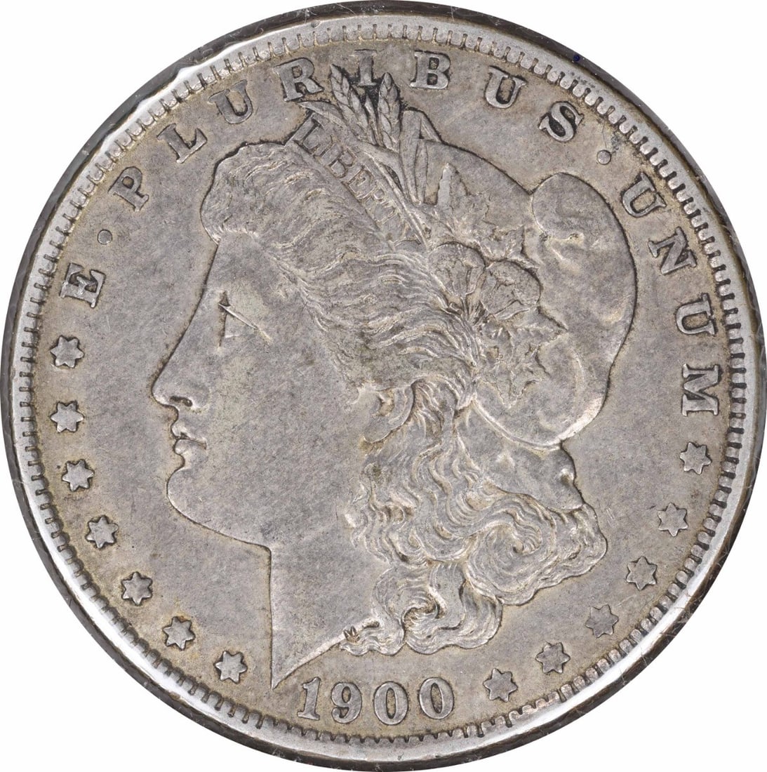 1900-O Morgan Silver Dollar Choice EF Uncertified 90% Silver Coin: 1900-O Morgan Silver Dollar Choice EF Uncertified 90% Silver Coin This 1900-O/CC Morgan Silver Dollar is a remarkable piece, showcasing intricate design by George T. Morgan. With a composition of 90% 