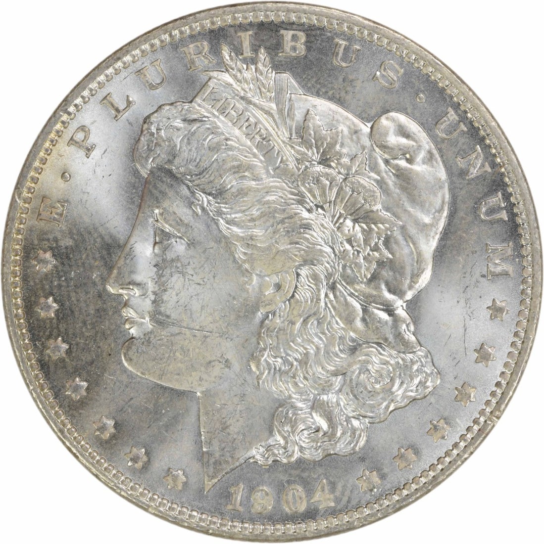 Uncertified 1904-O Morgan Silver Dollar Choice Brilliant Uncirculated: Uncertified 1904-O Morgan Silver Dollar Choice Brilliant Uncirculated This is a 1904-O Morgan Silver Dollar from the New Orleans Mint. The coin is composed of silver and is in Choice Brilliant Uncircu