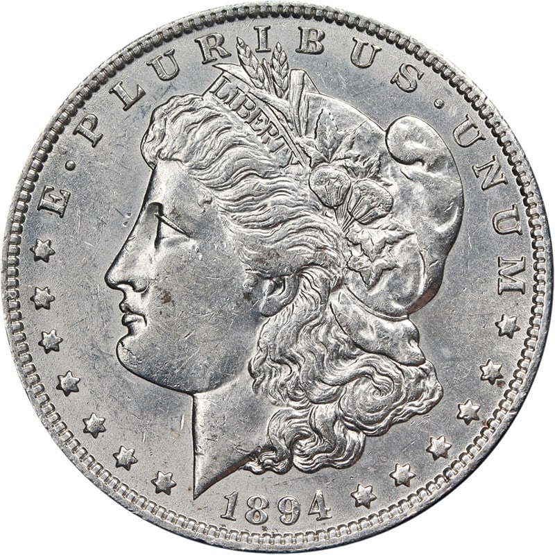 1894 O Silver Morgan Dollar AU BU: 1894 O Silver Morgan Dollar AU BU This 1894-O Morgan Silver Dollar features impressive eye appeal, strong luster, and a well-defined strike. The coin displays bright white color with attractive surfac