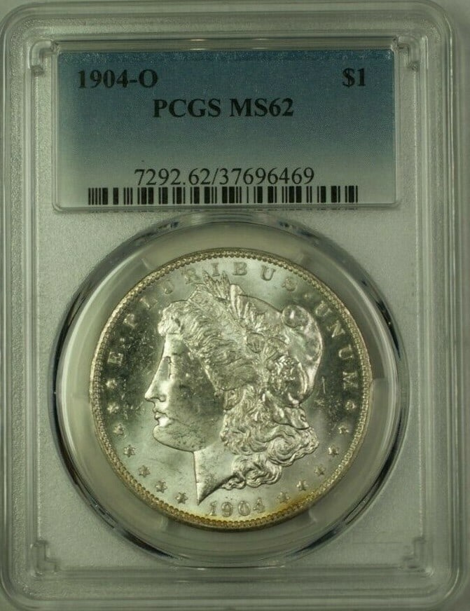PCGS MS-62 1904-O Morgan Dollar Silver Coin New Orleans Mint: PCGS MS-62 1904-O Morgan Dollar Silver Coin New Orleans Mint This is a 1904-O Morgan Silver Dollar $1 coin, certified by PCGS with a grade of MS-62. Struck at the New Orleans Mint, this uncirculated c