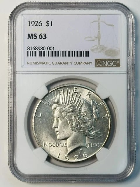 NGC MS 63 1926 Peace Silver Dollar: NGC MS 63 1926 Peace Silver Dollar 1926 Peace Dollar graded MS 63 by NGC. This pre-owned silver dollar was struck in the USA and is identified as a 1926 issue with denomination of Dollar. Specificatio