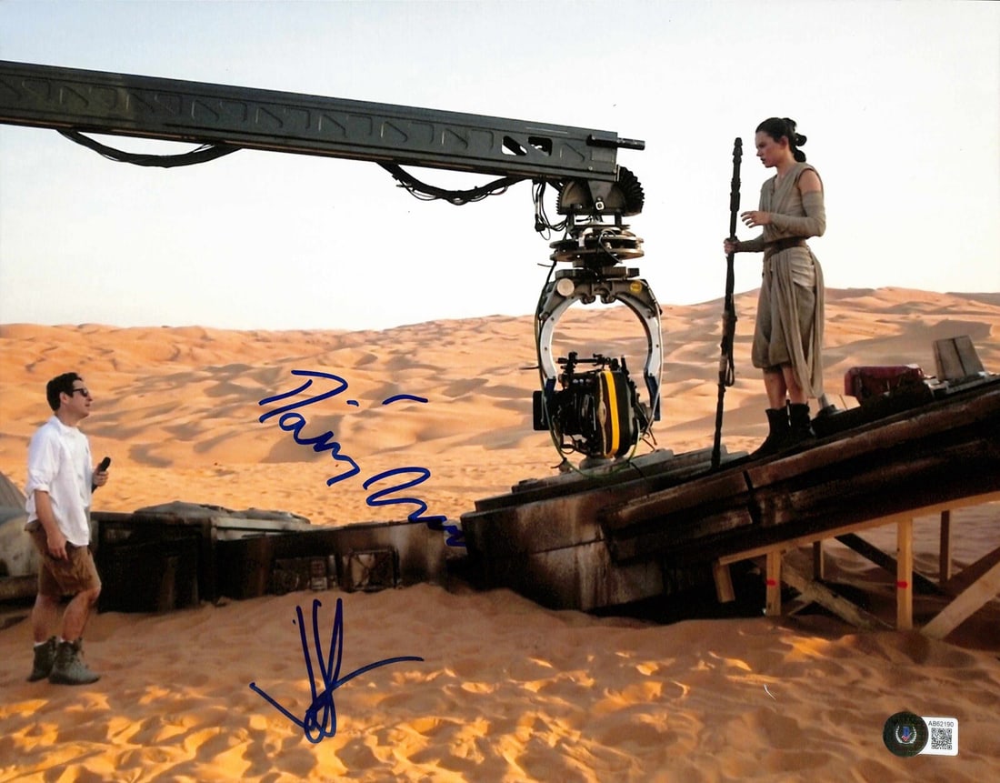 Beckett Authenticated Star Wars Force Awakens 11x14 Signed Photo Daisy Ridley JJ Abrams: Beckett Authenticated Star Wars Force Awakens 11x14 Signed Photo Daisy Ridley JJ Abrams This 11x14 photograph captures a behind-the-scenes moment from Star Wars: The Force Awakens and is hand-signed i