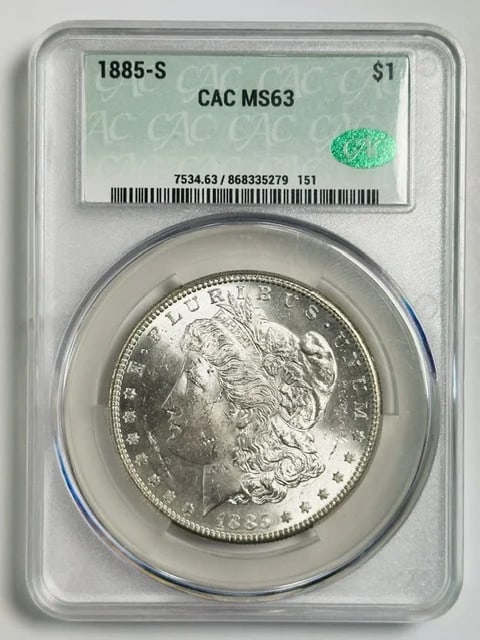 1885-S Morgan dollar CACG MS 63 certified silver coin: 1885-S Morgan dollar CACG MS 63 certified silver coin This 1885 Morgan Silver Dollar was minted in San Francisco and is composed of silver. It has been graded MS 63 and certified by CAC. The coin is p
