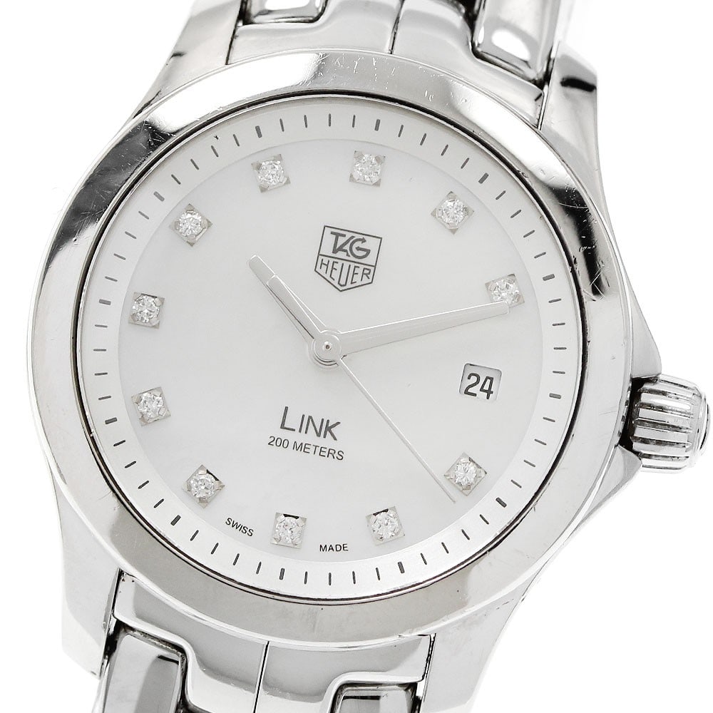 TAG Heuer Link Quartz Date White Mother of Pearl Ladies Watch: TAG Heuer Link Quartz Date White Mother of Pearl Ladies Watch This TAG Heuer Link Quartz women's wristwatch, model WJF1317.BA0572, features a stainless steel case and bracelet with a white mother-of-p