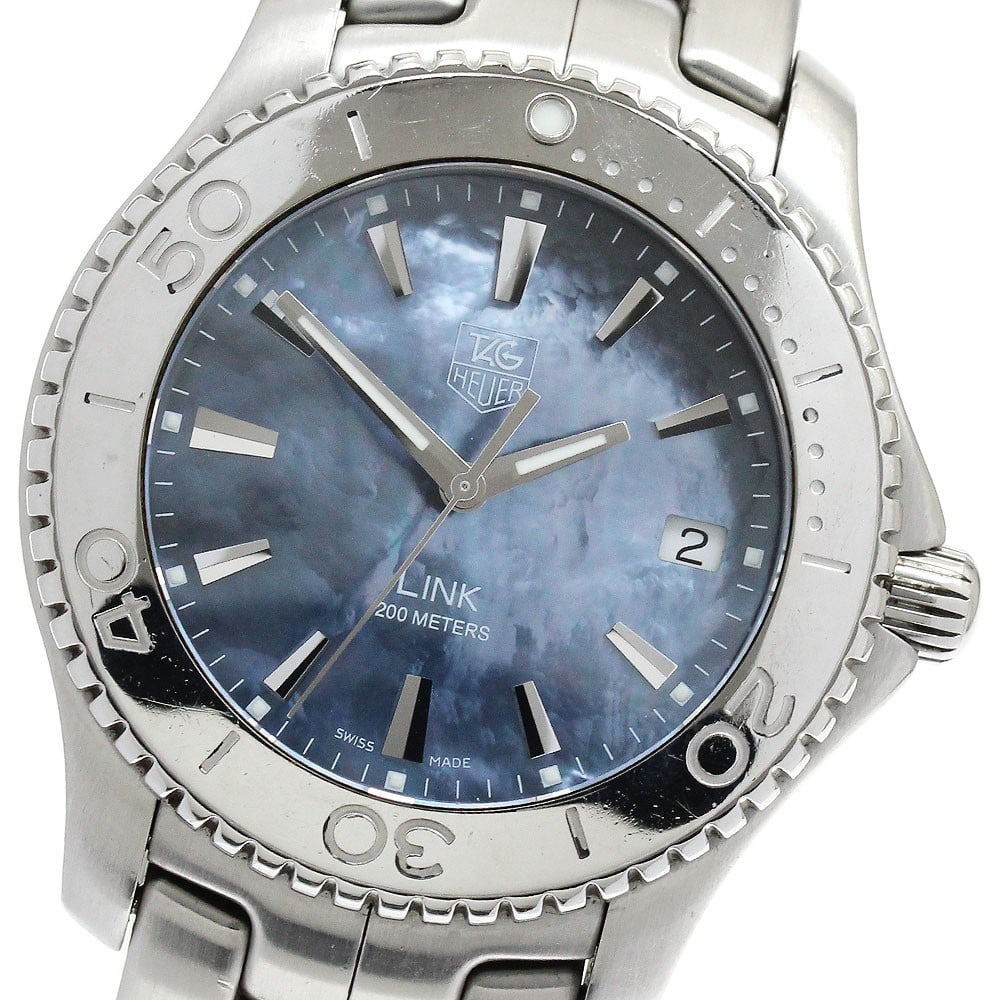TAG Heuer Link Date Quartz Stainless Steel Men's Watch WJ1119: TAG Heuer Link Date Quartz Stainless Steel Men's Watch WJ1119 This TAG Heuer Link Date Quartz men's wristwatch features a stainless steel case and bracelet with a blue shell dial. The watch is equippe