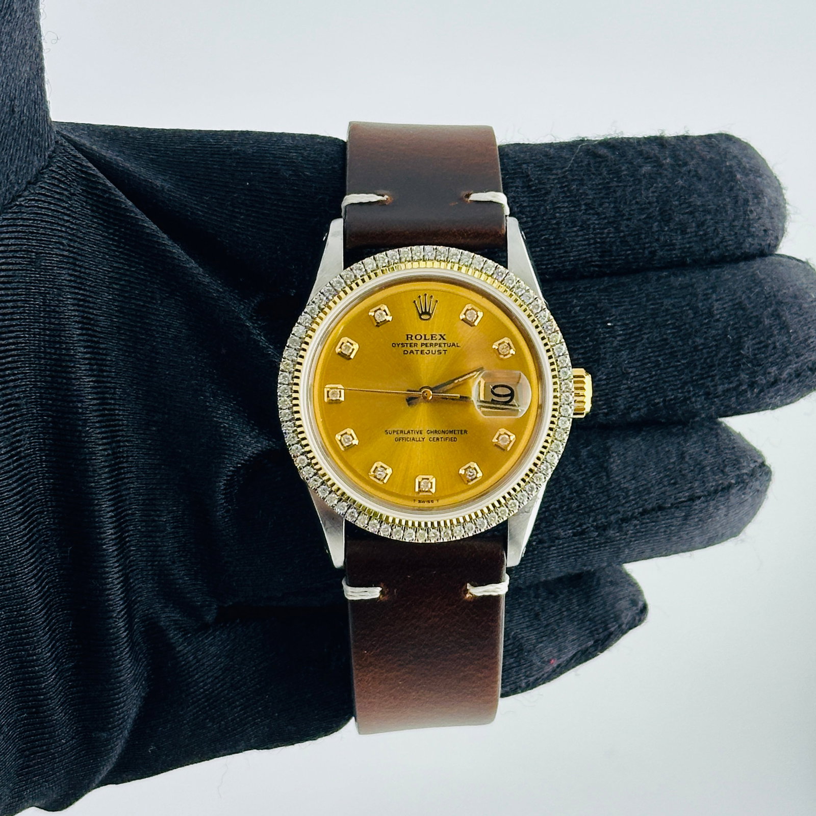Rolex Datejust Ref 1601 Watch with Champagne Diamond Dial and Aftermarket Leather Strap: Rolex Datejust Ref 1601 Watch with Champagne Diamond Dial and Aftermarket Leather Strap This Rolex Datejust men's watch features an Aftermarket champagne dial with yellow diamond markers. It has a pro