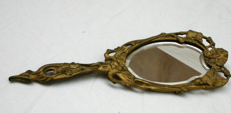 1900 French Art Nouveau Dore Bronze Beveled Mirror 13.5 x 4.6: 1900 French Art Nouveau Dore Bronze Beveled Mirror 13.5 x 4.6 This exquisite 1900 French Art Nouveau mirror features a stunning dore bronze frame that beautifully complements the beveled glass. The in
