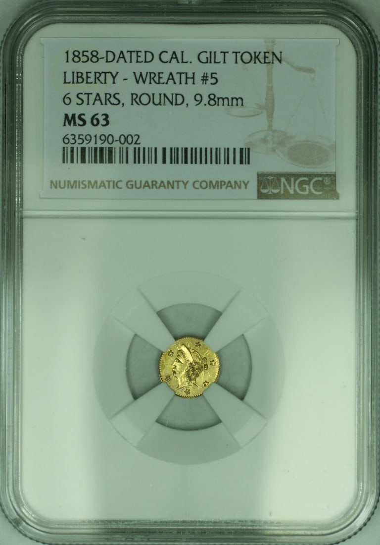 California 1858 Liberty Wreath Gold Token 9.8MM NGC MS 63 Six Stars: California 1858 Liberty Wreath Gold Token 9.8MM NGC MS 63 Six Stars This 1858 California gilt token features the Liberty - Wreath #5 design with 6 stars. Certified by NGC and graded MS-63, this round 