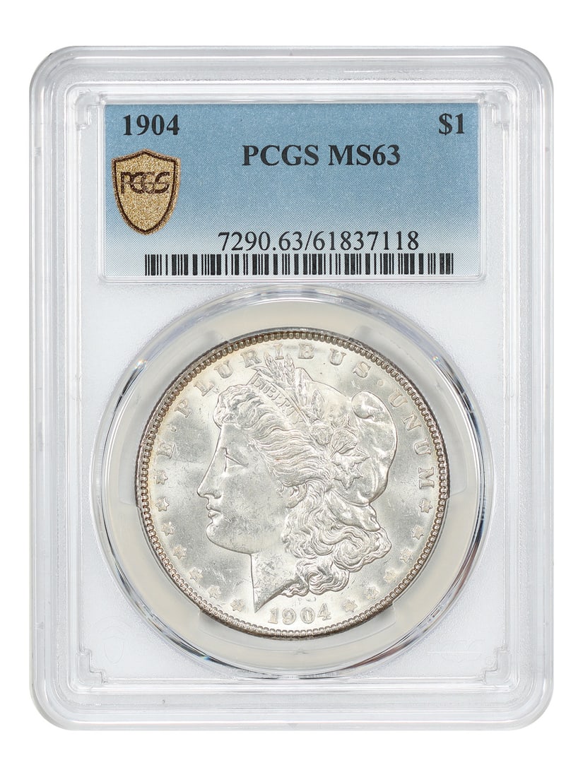 1904 Philadelphia Morgan Dollar $1 PCGS MS63 Uncirculated: 1904 Philadelphia Morgan Dollar $1 PCGS MS63 Uncirculated 1904 Morgan Dollar $1 from the Philadelphia Mint, certified by PCGS and graded MS63. This uncirculated coin is identified as an underrated P-M