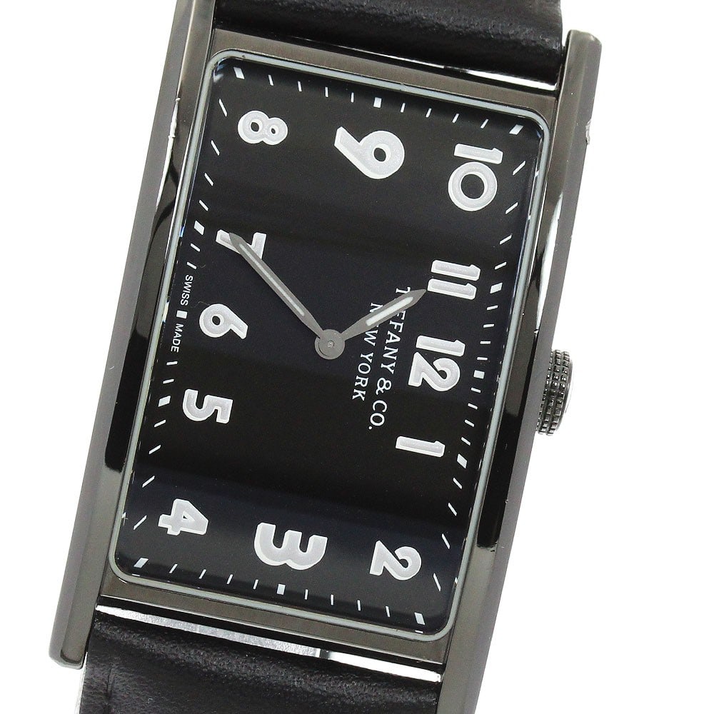 TIFFANY&Co. East-West 37447129 Quartz Wristwatch Unisex: TIFFANY&Co. East-West 37447129 Quartz Wristwatch Unisex Tiffany & Co. East-West quartz wristwatch for unisex wear. This pre-owned watch is identified as a Swiss-made wristwatch and is presented in the