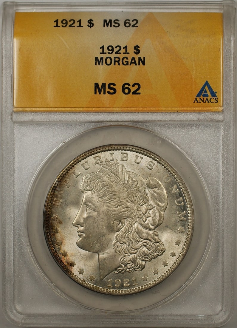 ANACS MS-62 1921 Morgan Silver Dollar Philadelphia: ANACS MS-62 1921 Morgan Silver Dollar Philadelphia This 1921 Morgan Silver Dollar features rim toning and has been graded MS-62 by ANACS. Struck in Philadelphia, this uncirculated coin is composed of 