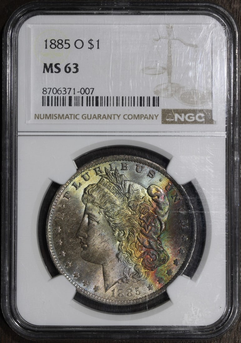 Rainbow Toned 1885-O Morgan Silver Dollar NGC MS63: Rainbow Toned 1885-O Morgan Silver Dollar NGC MS63 This 1885 Morgan Silver Dollar features a rainbow-toned finish and was minted in New Orleans. Graded MS63 by NGC, this pre-owned coin is composed of 