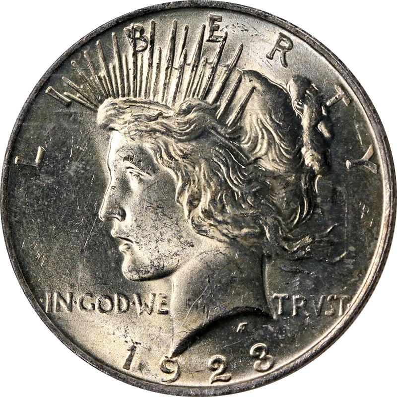 1923 Peace Silver Dollar NGC Certified MS63 With Toned Surface: 1923 Peace Silver Dollar NGC Certified MS63 With Toned Surface This 1923-P Peace Dollar is certified by NGC with a grade of MS63, indicating an uncirculated and well-preserved coin. Composed of 0.9 fi