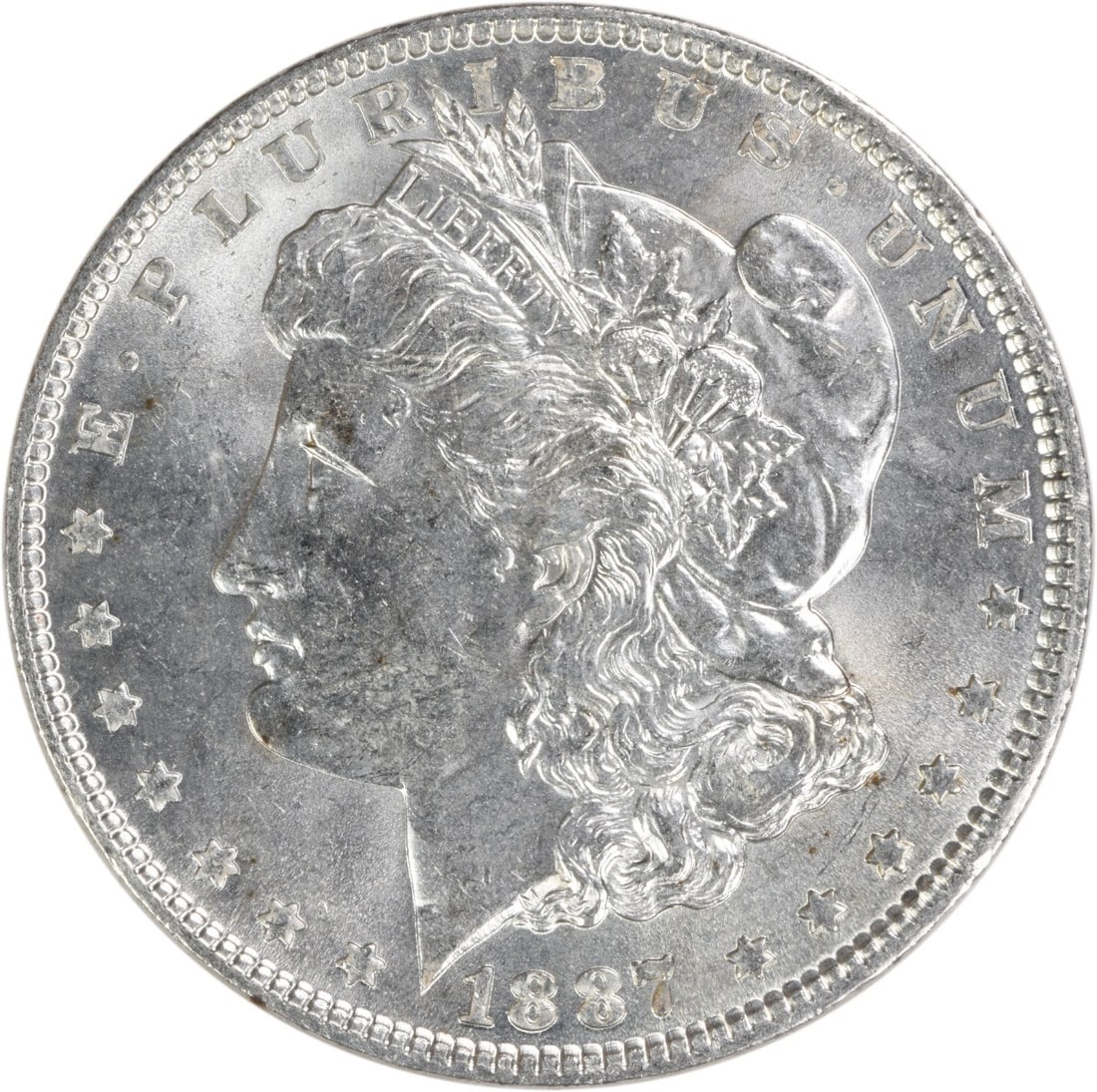 Choice BU 1887 Silver Morgan Dollar Uncirculated No Mint Mark: Choice BU 1887 Silver Morgan Dollar Uncirculated No Mint Mark This is an 1887 Morgan Silver Dollar, graded as Choice Brilliant Uncirculated (BU). It is uncertified and features no mint mark, indicatin