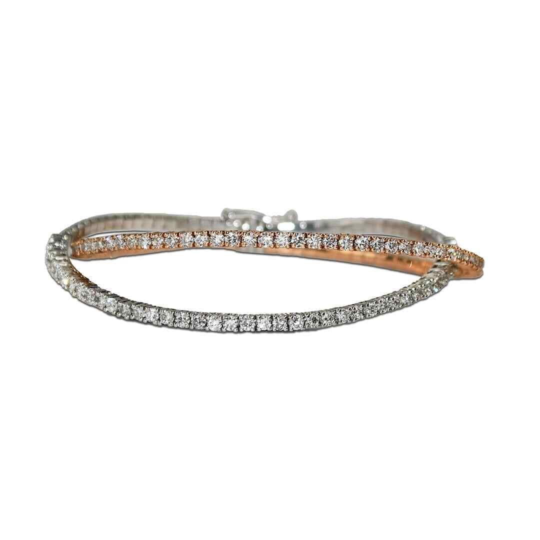 14k Two Tone Diamond Bangle Bracelet 3.00ct 6.5 in: 14k Two Tone Diamond Bangle Bracelet 3.00ct 6.5 in This elegant bangle bracelet is crafted from 14k two-tone gold, combining both rose and white gold for a sophisticated look. The bracelet features 86