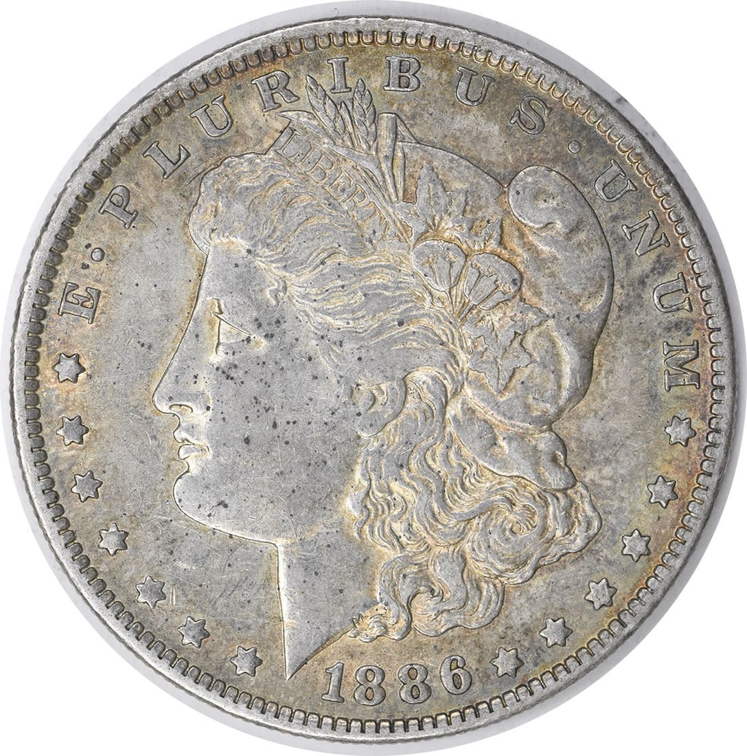 1886-O Morgan Silver Dollar 90% Silver Uncertified Coin: 1886-O Morgan Silver Dollar 90% Silver Uncertified Coin This 1886-O Morgan Silver Dollar features a stunning design by George T. Morgan, showcasing the iconic portrait of Liberty. Minted in New Orlean
