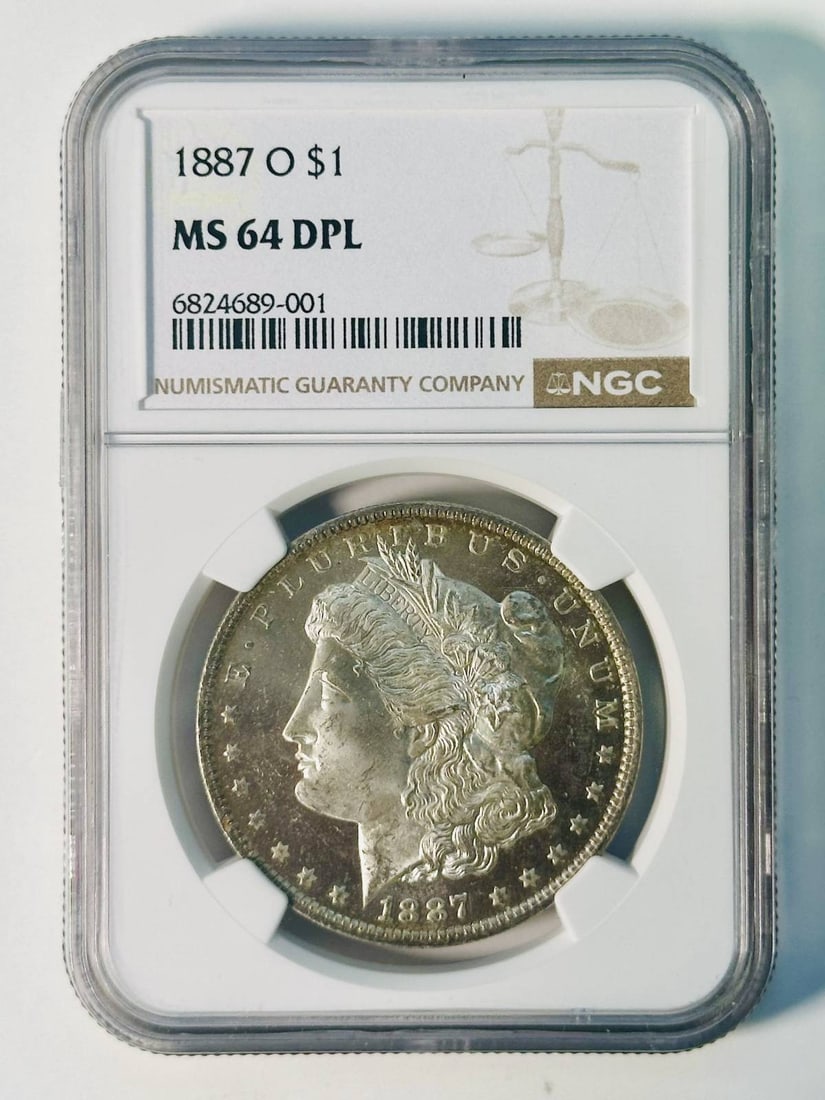 NGC MS-64 DPL 1887 O Morgan Silver Dollar Cameo Look: NGC MS-64 DPL 1887 O Morgan Silver Dollar Cameo Look 1887-O Morgan Silver Dollar certified by NGC and graded MS 64. The coin is composed of silver, has a dollar denomination, and was minted in New Orl