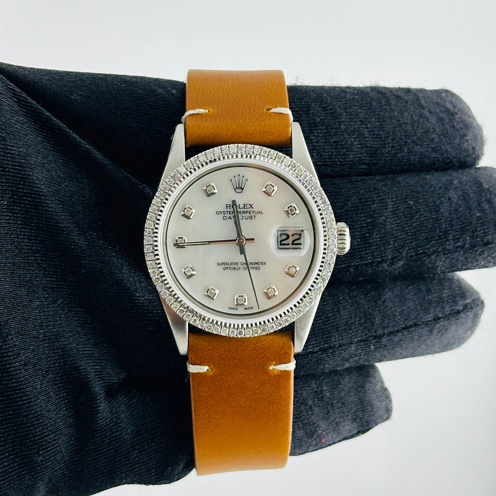Rolex Datejust Ref 1601 Watch With Aftermarket White MOP Diamond Dial and Leather Strap: Rolex Datejust Ref 1601 Watch With Aftermarket White MOP Diamond Dial and Leather Strap This Rolex Datejust features an aftermarket white mother-of-pearl dial set with diamond hour markers and a prong