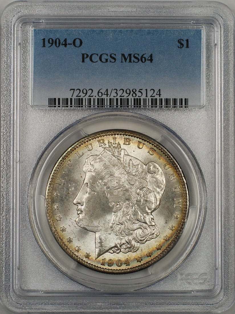 PCGS MS64 1904-O Morgan Dollar Silver Coin New Orleans Toned Rim: PCGS MS64 1904-O Morgan Dollar Silver Coin New Orleans Toned Rim This 1904-O Morgan Silver Dollar features a toned rim and is graded MS-64 by PCGS. Minted in New Orleans, it is composed of silver and 