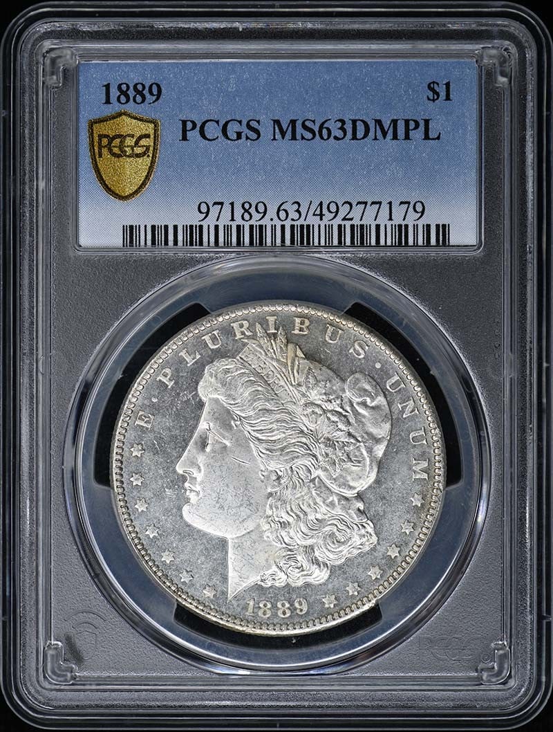 1889 Morgan Dollar PCGS MS63 DMPL: 1889 Morgan Dollar PCGS MS63 DMPL This is an 1889 Morgan Dollar graded MS63DMPL by PCGS. The coin is uncirculated and features the Deep Mirror Prooflike (DMPL) designation, indicating highly reflectiv