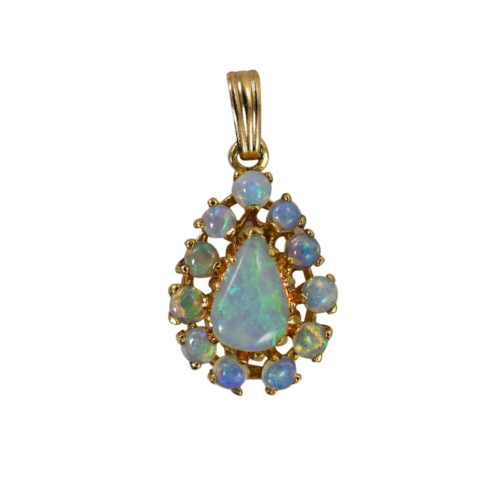 14k Yellow Gold Tear Drop Pendant with 12 Australian Opals: 14k Yellow Gold Tear Drop Pendant with 12 Australian Opals This pendant features genuine Australian opals set in a 14K yellow gold teardrop design. The pendant showcases twelve opals with vibrant blue