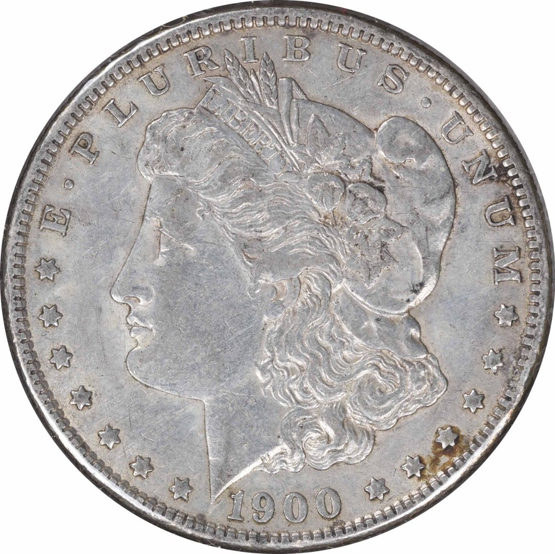 AU Grade 1900-O Over CC Morgan Dollar Uncertified Silver Coin: AU Grade 1900-O Over CC Morgan Dollar Uncertified Silver Coin This 1900-O/CC Morgan Silver Dollar is an attractive example of early 20th-century American coinage. Struck at the New Orleans Mint, this 