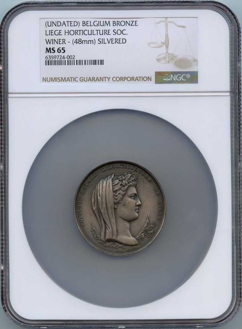 48mm Silvered Belgium Bronze Liege Horticulture Society Medal NGC MS65: 48mm Silvered Belgium Bronze Liege Horticulture Society Medal NGC MS65 This Belgium bronze medal from the Liege Horticulture Society features a silvered finish and measures 48mm in diameter. Graded MS