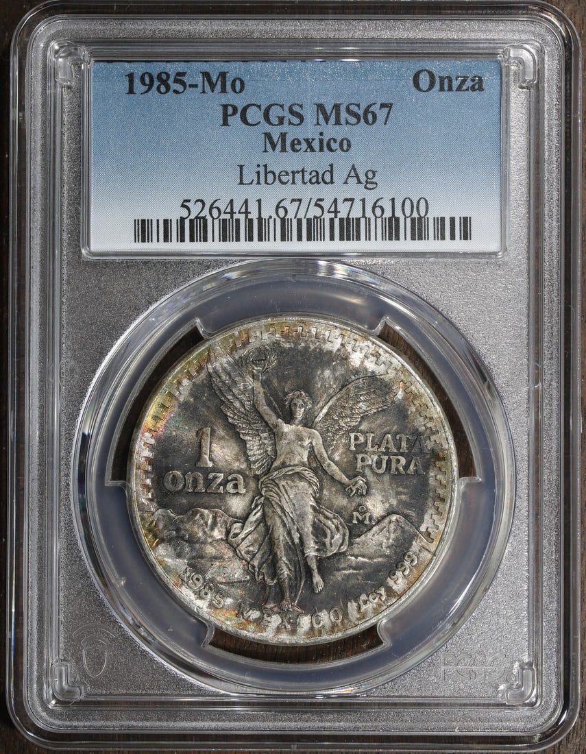 PCGS MS67 1985-Mo Mexico 1 oz Silver Libertad Onza Coin: PCGS MS67 1985-Mo Mexico 1 oz Silver Libertad Onza Coin 1985 Mexico 1 oz Silver Libertad Onza coin certified by PCGS and graded MS67. It is composed of 0.999 fine silver and was minted by the Mexican 