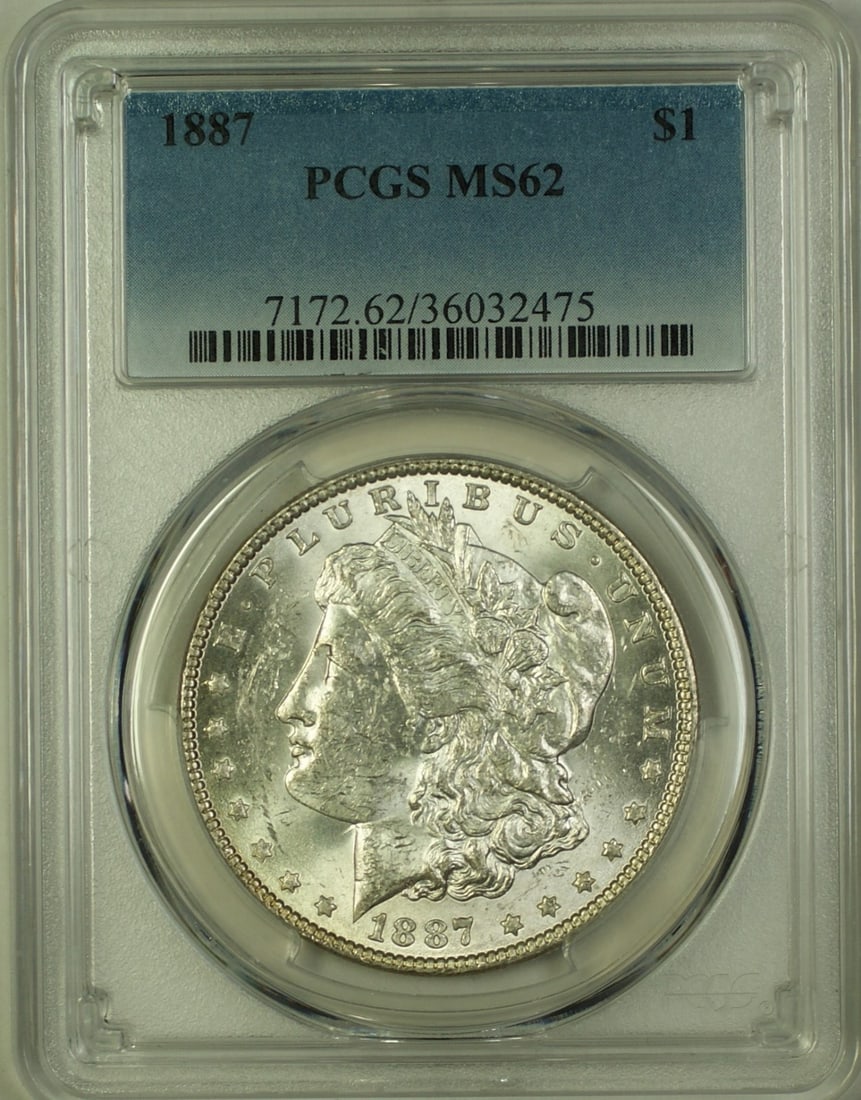 PCGS MS-62 1887 Morgan Dollar Silver $1: PCGS MS-62 1887 Morgan Dollar Silver $1 This 1887 Morgan Silver Dollar is graded MS-62 by PCGS and was minted in Philadelphia. The coin is uncirculated and composed of silver, featuring a denomination