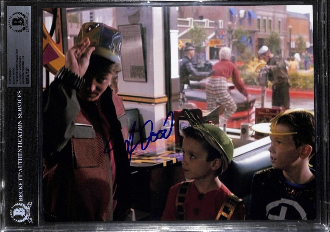 8x10 Back to the Future Part II Elijah Wood autograph Beckett grade 10: 8x10 Back to the Future Part II Elijah Wood autograph Beckett grade 10 This 8x10 photo from Back to the Future Part II is hand-signed by Elijah Wood and comes encapsulated in a slabbed case. The autog
