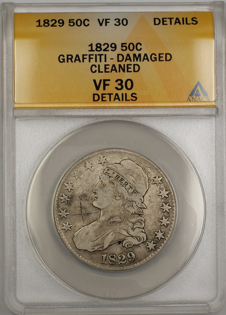 ANACS Certified 1829 Capped Bust Silver Half Dollar VF-30 Details Graffiti Issue: ANACS Certified 1829 Capped Bust Silver Half Dollar VF-30 Details Graffiti Issue This 1829 Capped Bust half dollar coin was minted in Philadelphia and is composed of silver. It has been graded by ANAC