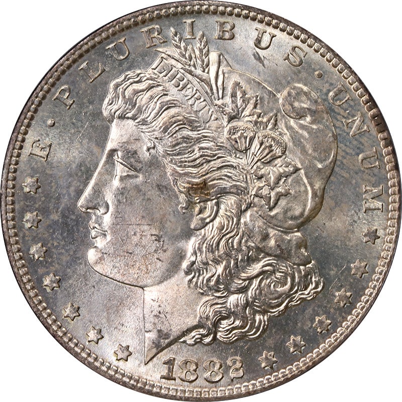 PCGS MS65 1882-S Morgan Silver Dollar Light Toning: PCGS MS65 1882-S Morgan Silver Dollar Light Toning This 1882-S Morgan Silver Dollar is graded MS65 by PCGS and features light toning. Certified by PCGS, this uncirculated coin is composed of silver wi