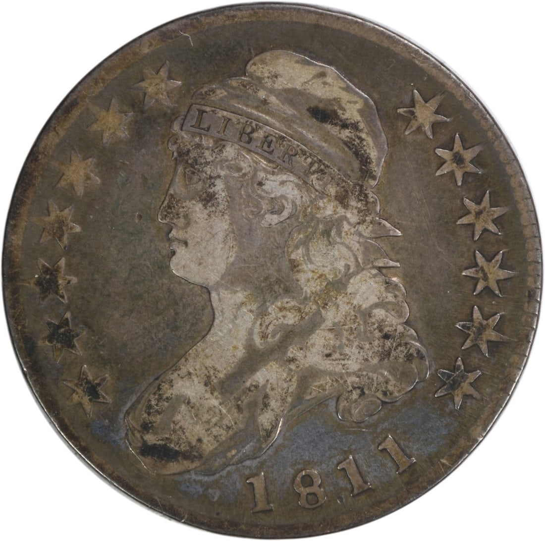 1811 Bust Half Dollar VF Silver 50C John Reich Design: 1811 Bust Half Dollar VF Silver 50C John Reich Design This 1811 Bust Half Dollar is an exquisite piece of American numismatic history. Struck at the Philadelphia Mint, this coin features a design by J