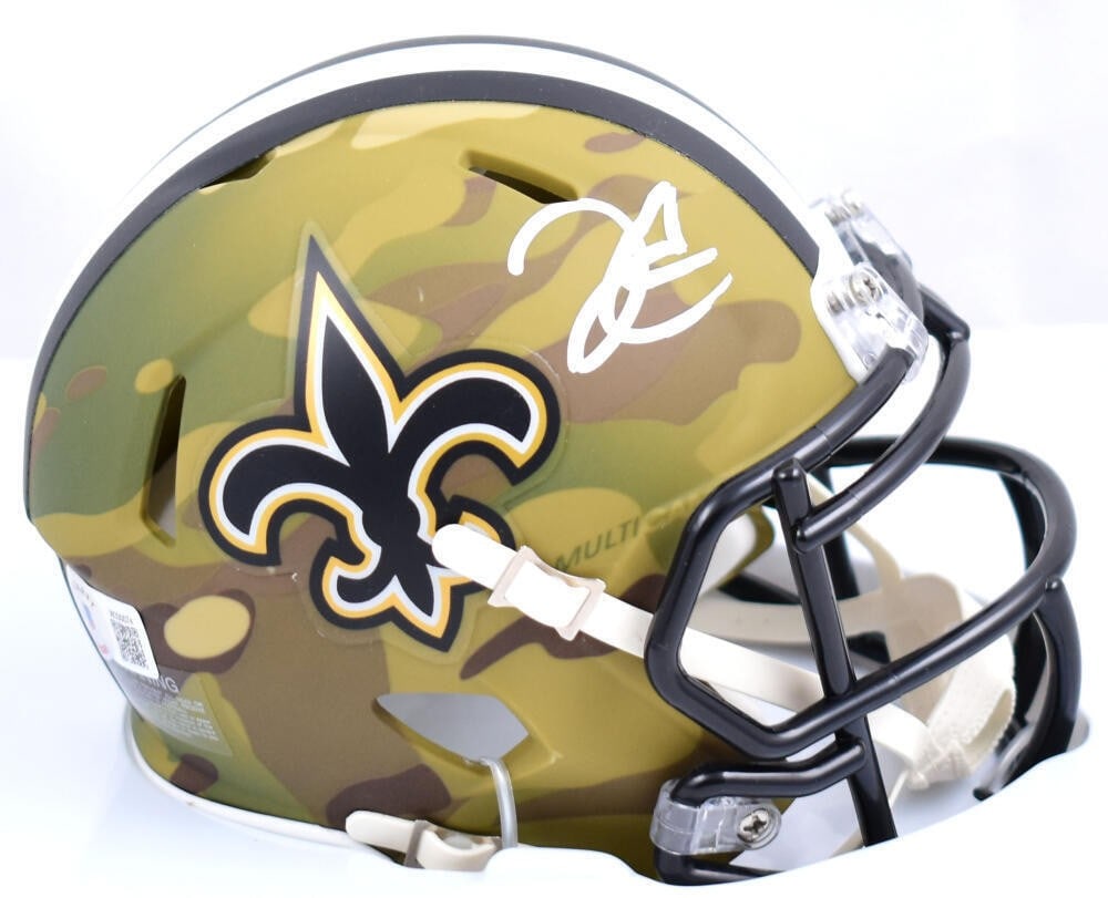 Derek Carr Signed Saints Camo Speed Mini Helmet Beckett Holo: Derek Carr Signed Saints Camo Speed Mini Helmet Beckett Holo This is an original autographed New Orleans Saints camo Speed mini helmet signed by Derek Carr. It is a football helmet from the United Sta