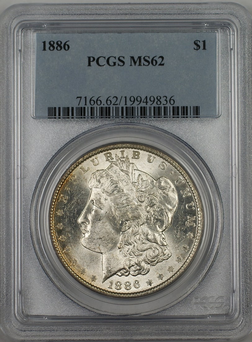 PCGS MS62 1886 Morgan Silver Dollar Toned Rim: PCGS MS62 1886 Morgan Silver Dollar Toned Rim This 1886 Morgan Silver Dollar features a toned rim and has been graded MS-62 by PCGS. Struck in Philadelphia, this uncirculated coin is composed of silve