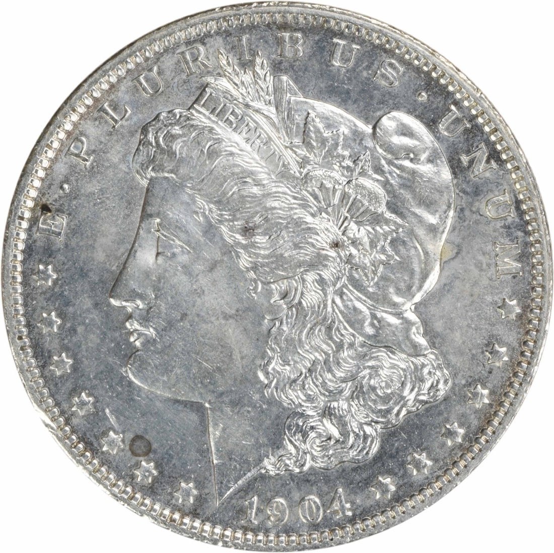 Uncirculated 1904 O Morgan Silver Dollar Brilliant Uncertified US Coin: Uncirculated 1904 O Morgan Silver Dollar Brilliant Uncertified US Coin This is a 1904-O Morgan Silver Dollar from the United States, featuring the New Orleans mintmark. The coin is in Brilliant Uncirc