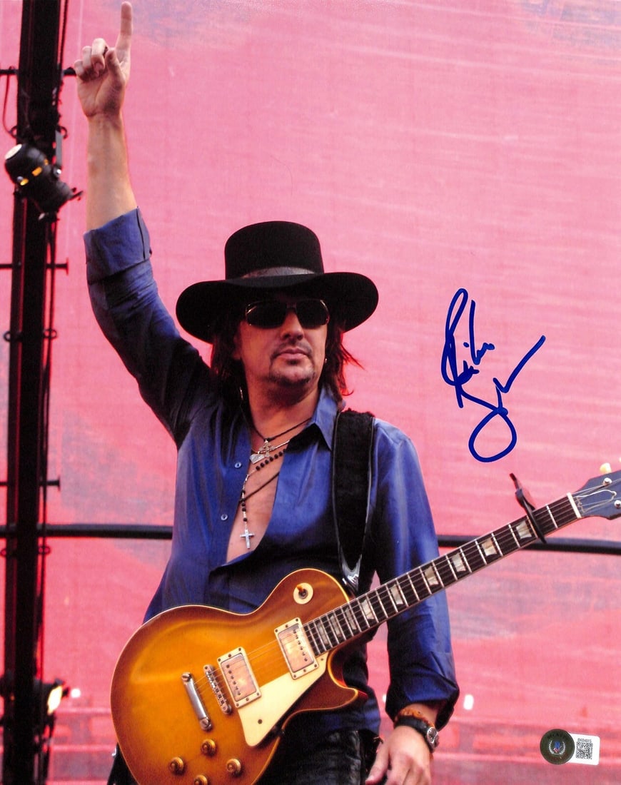 Richie Sambora Signed 11x14 Photo with Beckett Authentication: Richie Sambora Signed 11x14 Photo with Beckett Authentication This is an original 11x14 photograph signed by Richie Sambora, the former guitarist of Bon Jovi. The autograph, executed in blue permanent