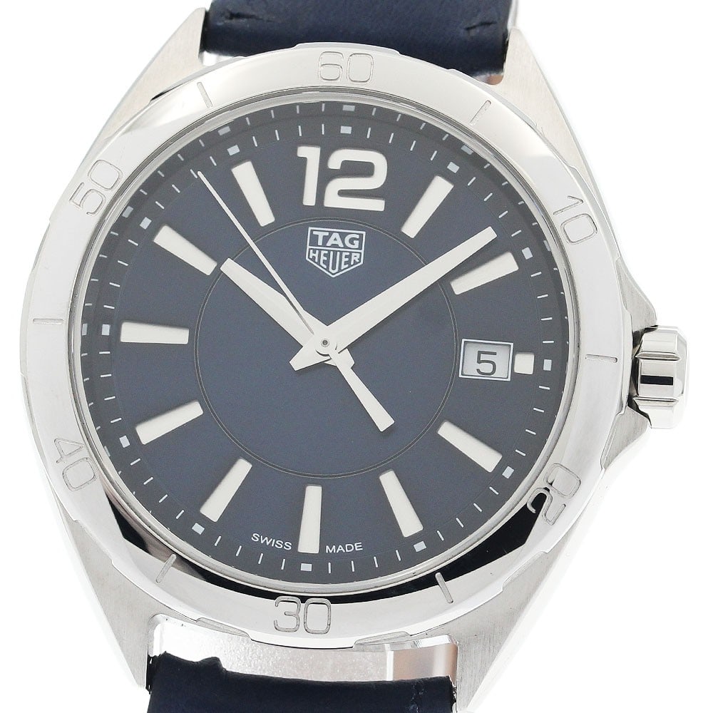TAG Heuer Formula 1 Navy Dial Quartz Date Watch WBJ1312: TAG Heuer Formula 1 Navy Dial Quartz Date Watch WBJ1312 This TAG Heuer Formula 1 Date Quartz women's wristwatch features a stainless steel case paired with a navy dial and a leather strap. The watch i