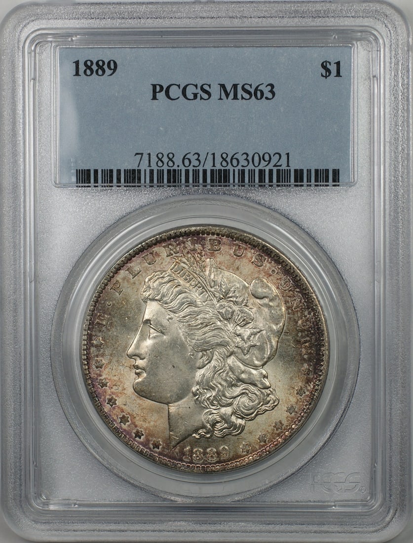 PCGS MS63 1889 Silver Dollar Morgan Lightly Toned Philadelphia Mint: PCGS MS63 1889 Silver Dollar Morgan Lightly Toned Philadelphia Mint This 1889 Morgan Silver Dollar features a light toning and has been graded MS-63 by PCGS. Minted in Philadelphia, it is composed of 
